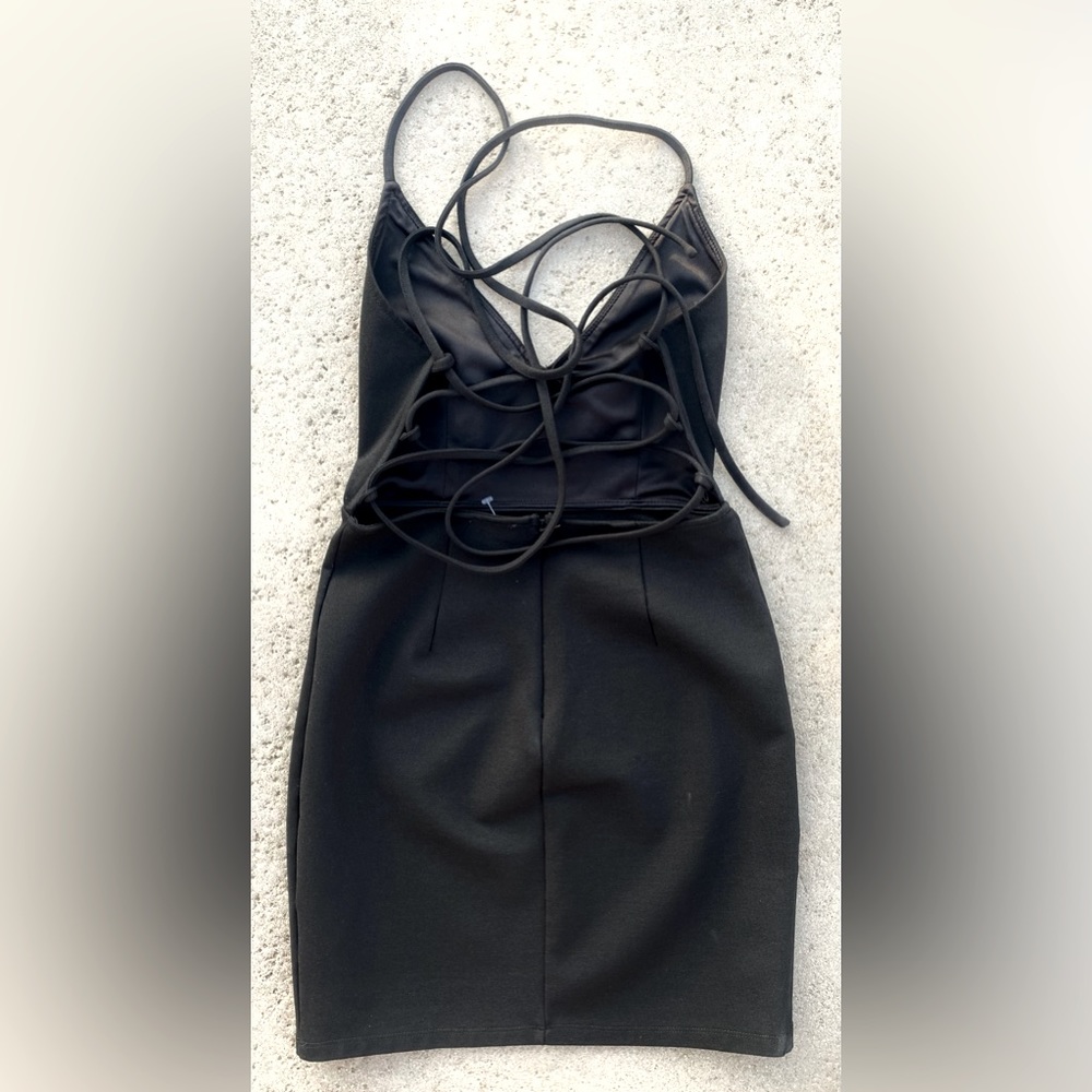 Halter Dress. New Black stringed backside form fitting one of a kind. XS